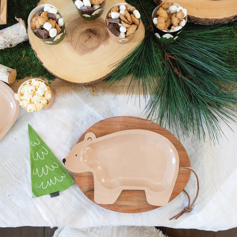Tree napkin placed beside a bear-shaped plate and rustic food setup, enhancing the forest party theme.