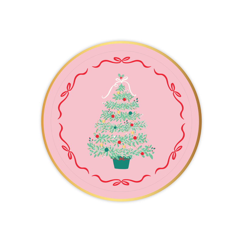 Pink Christmas Tree dessert plate with illustrated green tree and red ribbon border on a pink background.