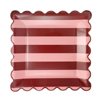 Pink & Burgundy striped square scalloped paper plate on white background
