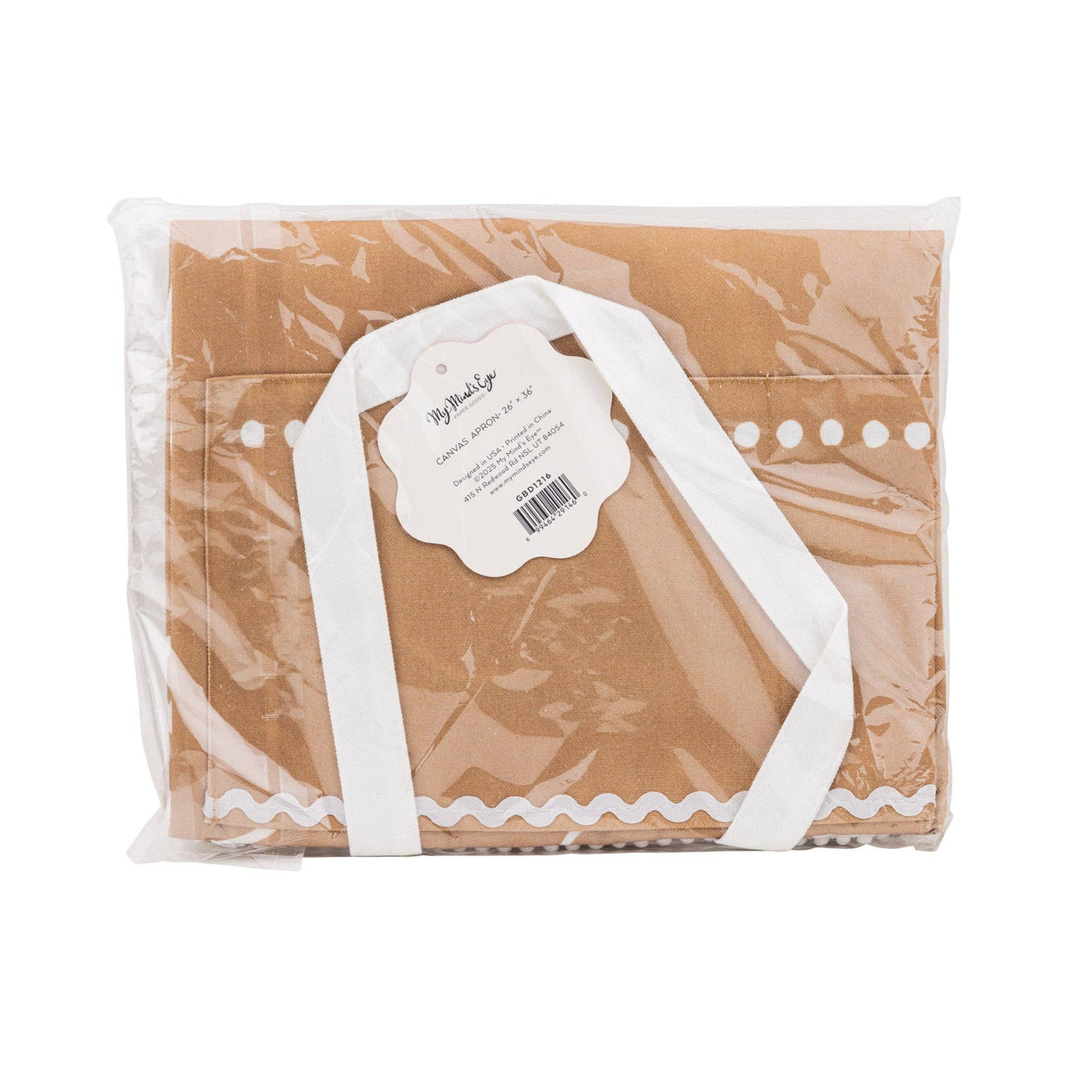 Back view of the Gingerbread Apron – Adult in packaging, showing the canvas material and product label with size and care details.