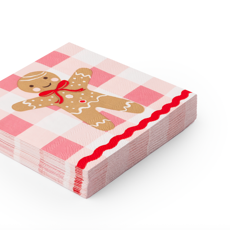 Stack of folded Sweet Gingerbread Small Napkins featuring pink gingham design and gingerbread man illustration.