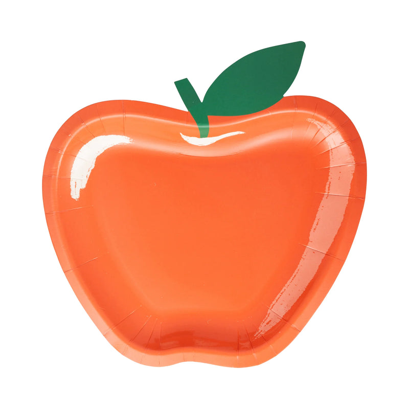 Close-up view of a single apple-shaped plate with a glossy red finish and green leaf cutout.