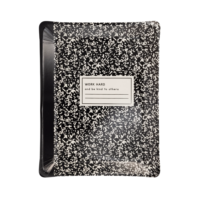 Close-up front view of notebook-shaped plate showing its textured black-and-white cover look