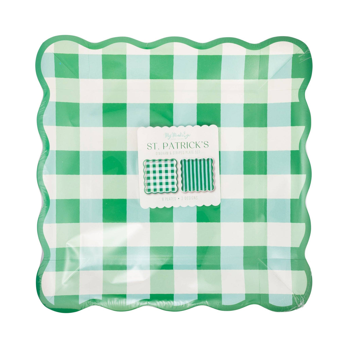Gingham and stripe green paper plates stacked with scalloped edges in packaging
