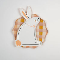 Bunny-shaped plates paired with matching pastel napkins and Easter table decor for a festive brunch setup.