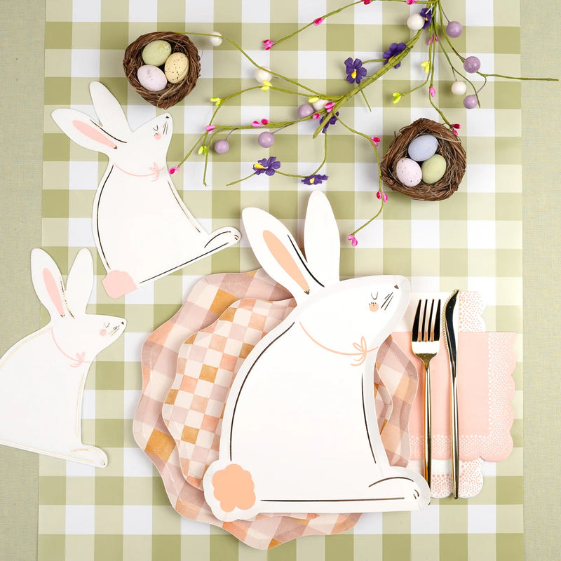Pastel checkered dinner plates styled on a gingham tablecloth with bunny napkins, gold flatware, and spring florals. A perfect choice for Easter and seasonal gatherings.