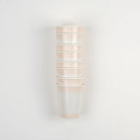 Set of Harmony Polka Dots Paper Cups neatly arranged on a drink station for an Easter gathering.