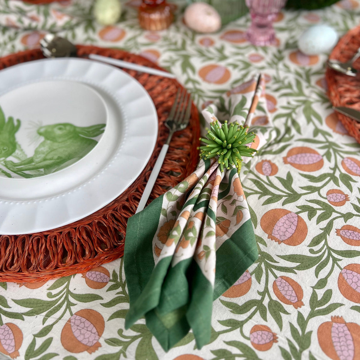 floral cloth napkin in green and orange pomegranate design - perfect for a spring table or an Easter tablescape. These are lovely spring Napkins.