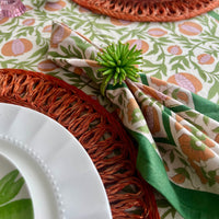 floral cloth napkin in green and orange pomegranate design - perfect for a spring table or an Easter tablescape. These are lovely spring Napkins.