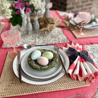 Gray velvet bow napkin ring on a spring table.
