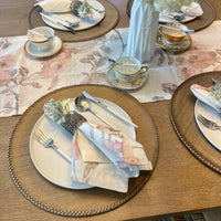 Discover the secret to an effortlessly elegant table setting with our taupe Lexington Placemats. These round vinyl wonders not only add a stylish touch to any meal but also promise a quick cleanup with their wipeable surface. Perfect as a Mother's Day gift, they're a chic, practical choice for the discerning hostess.