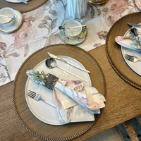 Discover the secret to an effortlessly elegant table setting with our taupe Lexington Placemats. These round vinyl wonders not only add a stylish touch to any meal but also promise a quick cleanup with their wipeable surface. Perfect as a Mother's Day gift, they're a chic, practical choice for the discerning hostess.