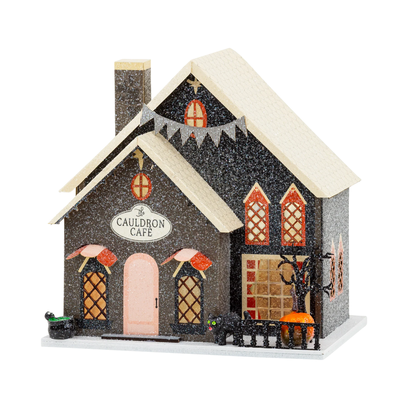 Cauldron Cafe light up Halloween village house in black glitter with pink door, black cat and cathedral windows