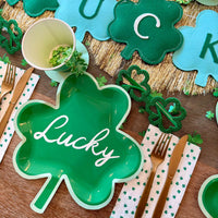 Lucky paper plate styled on St. Patrick's Day table with other coordinating tableware