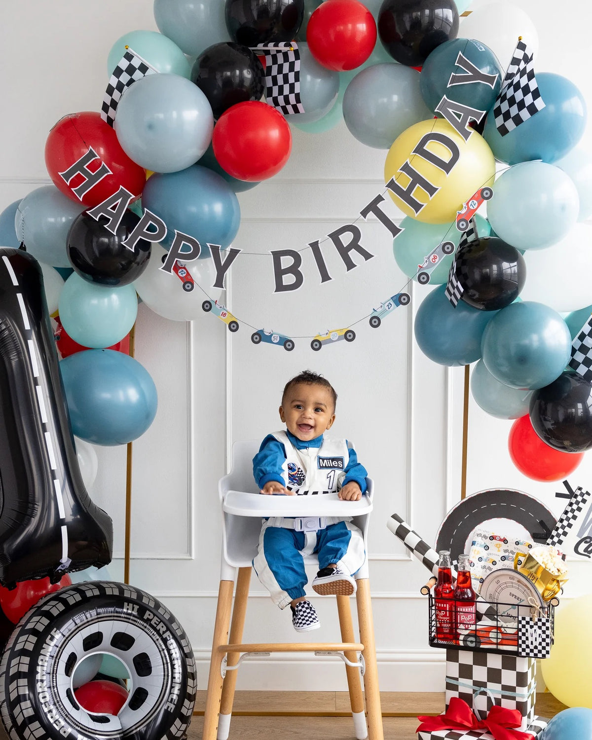 Miles Per Hour Happy Birthday Banner enhancing both indoor and outdoor setups for a versatile car-themed birthday celebration.