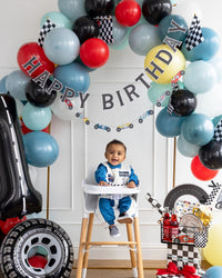 Miles Per Hour Happy Birthday Banner enhancing both indoor and outdoor setups for a versatile car-themed birthday celebration.