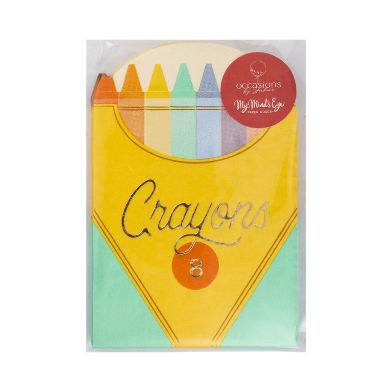 Crayon box napkins in packaging with foil-accented label and crayon illustrations visible at the top.
