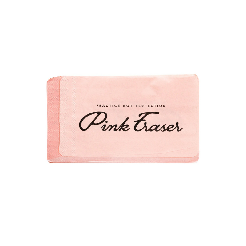 Unwrapped eraser-shaped napkin showing the full pink design and “Practice Not Perfection” phrase in black script.