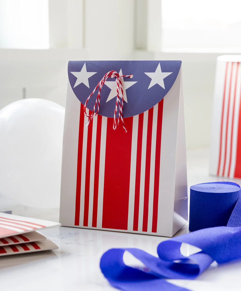 Close-up of a patriotic treat bag tied with red and white baker’s twine, great for filling with candy or small toys.