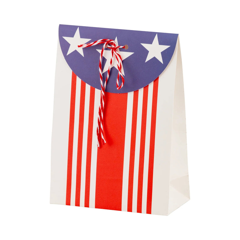 Festively decorated kids' party bags with stars, stripes, and baker's twine, ideal for July 4th celebrations.