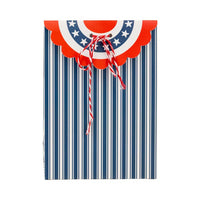 Patriotic bunting treat bag featuring navy stripes and a scalloped red, white, and blue flap, perfect for older children's party favors.