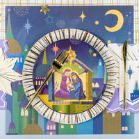 Decorative plate with nativity scene design, fork, and knife on a festive background