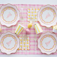 A beautifully styled Easter table featuring Sweet Carrot Easter napkins paired with matching pastel tableware, fresh florals, and festive decorations for a charming seasonal setup.