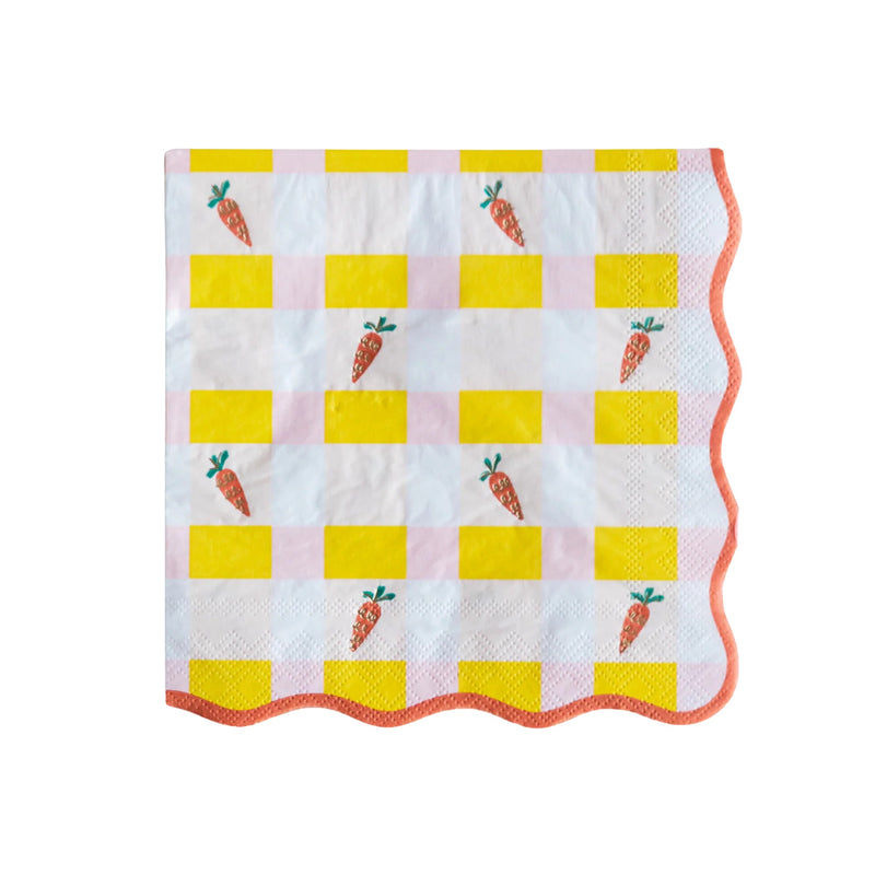 A close-up of a single Sweet Carrot Easter napkin, showcasing a playful checkered pattern in yellow and pink with charming carrot details, finished with a scalloped orange trim.