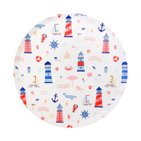 Round paper plate decorated with colorful seaside illustrations including red and blue lighthouses, sailboats, seagulls, jellyfish, anchors, and sandcastles.