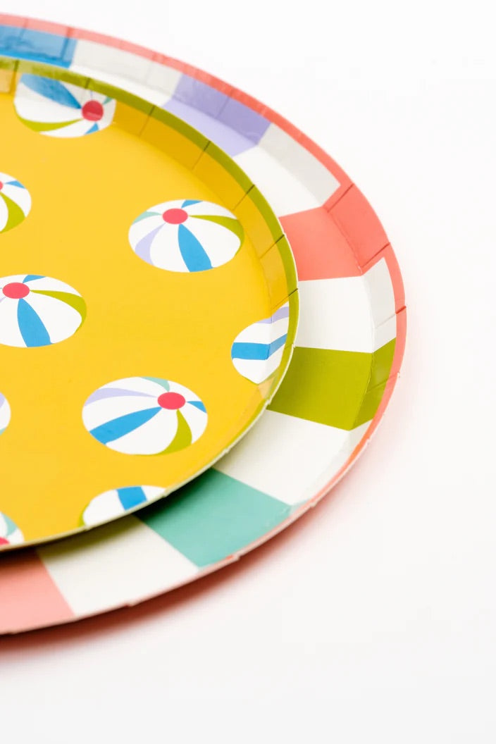 A detailed shot of the summer-themed dessert plates showing bold, tropical designs with beach umbrellas and beach balls, adding a fun touch to any summer gathering.