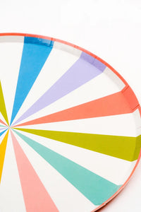 Striped summer dinner plates stacked with smaller beach ball and umbrella-themed dessert plates—perfect for a pool party.