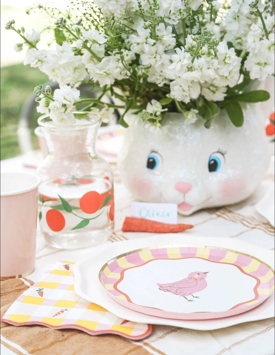 An Easter table setting featuring Sweet Carrot Easter napkins with a classic gingham design and playful carrot accents—perfect for brunch, baby showers, and spring parties.