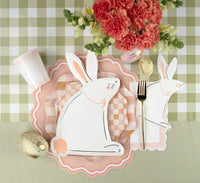Peach polka dot guest towels placed at an Easter tables setting