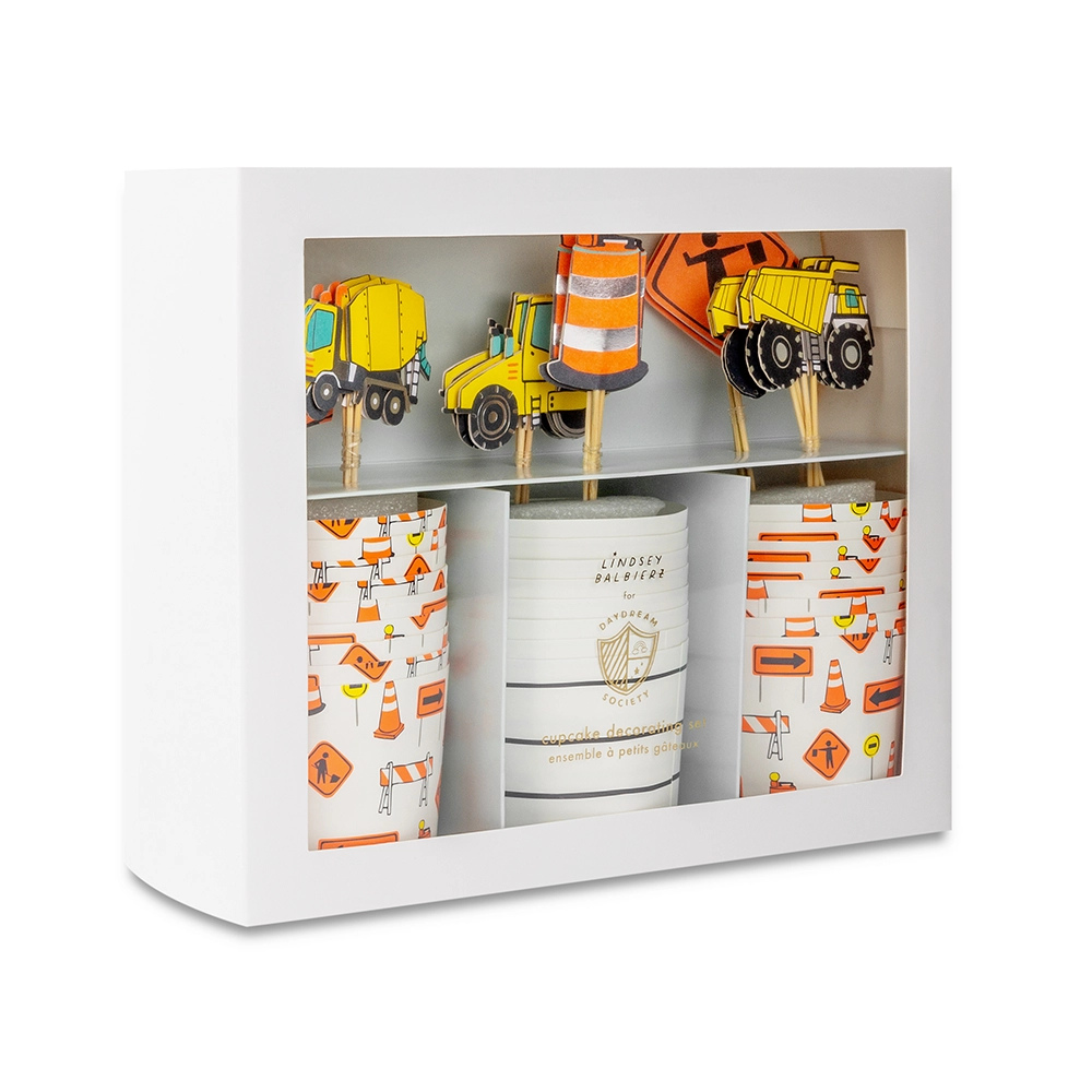 Image of the Under Construction Cupcake Decorating Set boxed, showing toppers and baking cups with construction designs.