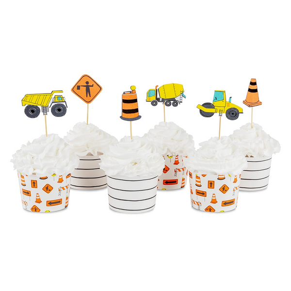 Set of six cupcakes with various construction-themed toppers and printed baking cups.