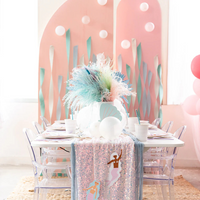 Under the Sea-themed party table featuring clear chairs, pastel sequin runner, and hanging mermaid decor from the Thingamajigs set.