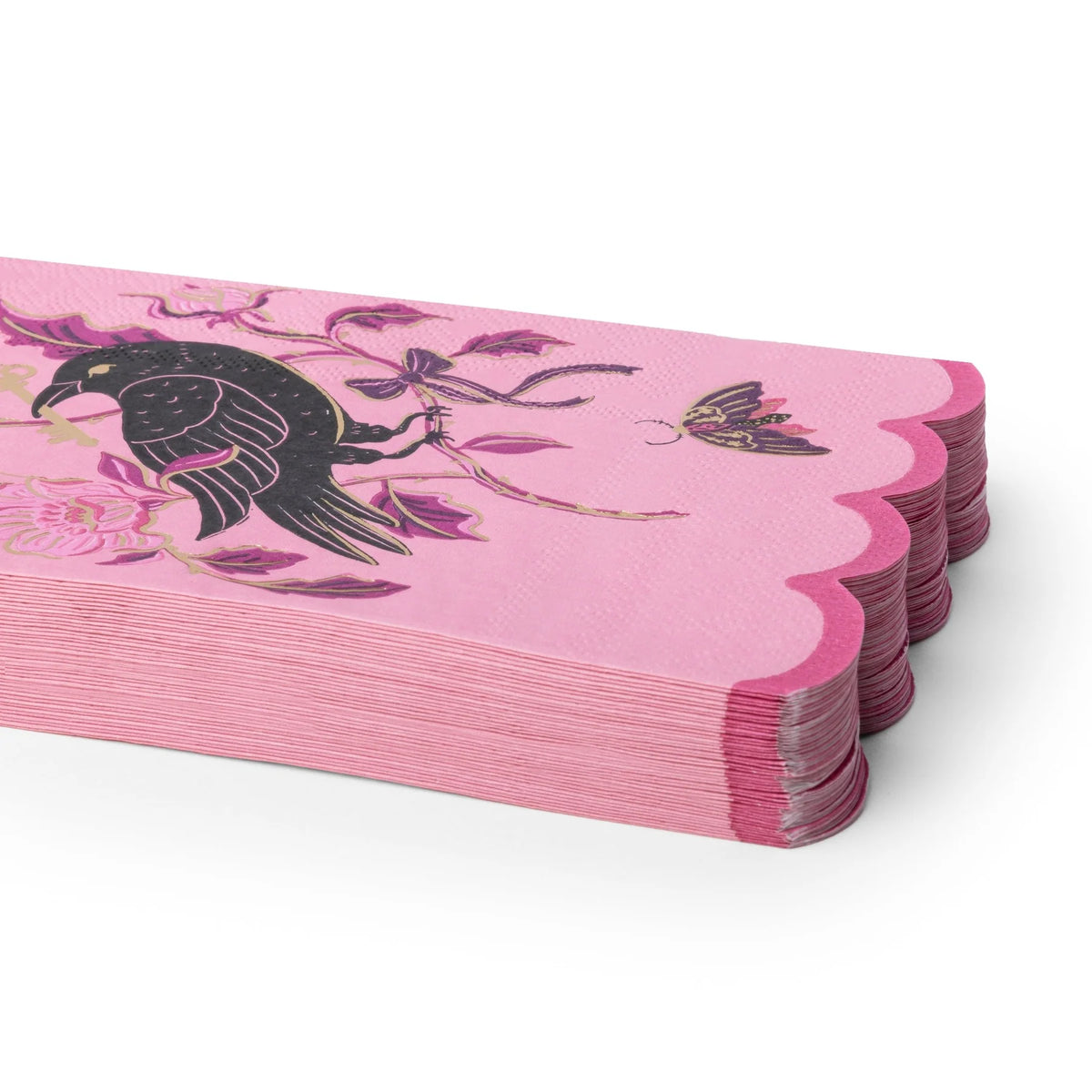 Pink Halloween paper placemats with scalloped edges and a black raven design.