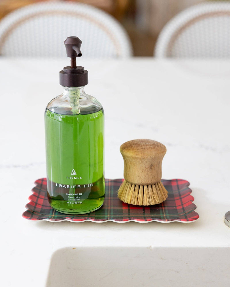 Close-up of plaid bamboo tray with soap brush and green Frasier Fir hand soap