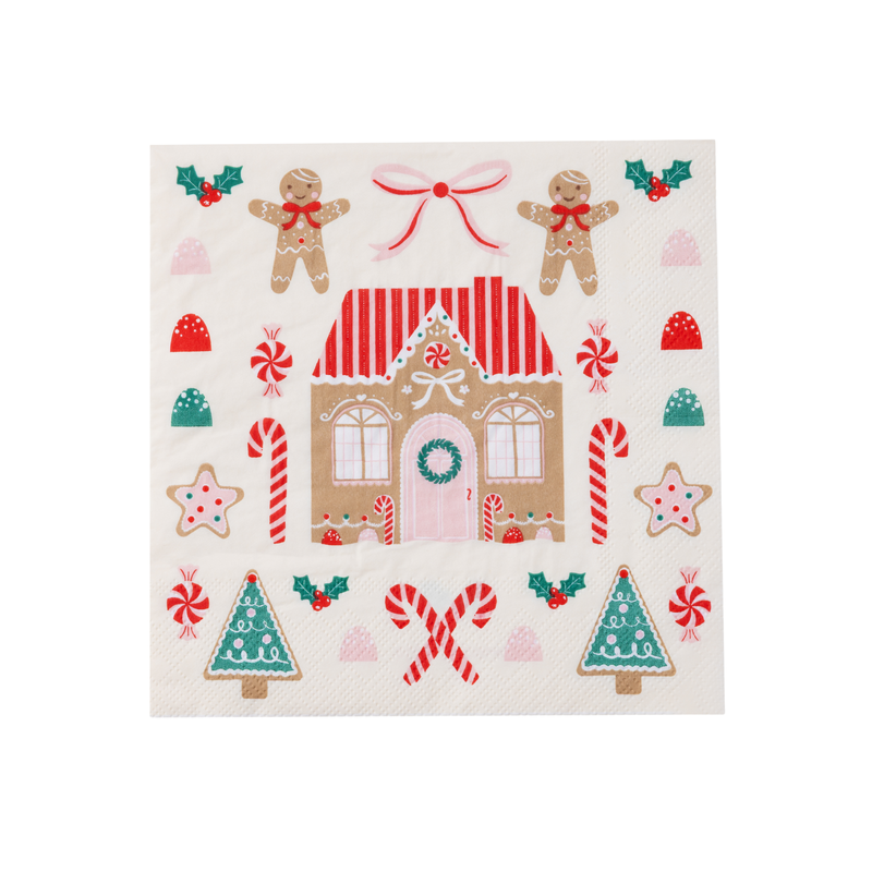 Full view of napkin featuring gingerbread house, candy canes, gumdrops, and Christmas trees.