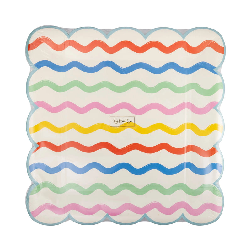 Hero plate front – Close-up of a single square plate showing bold rainbow ric-rac stripes across a cream background, finished with a light blue scalloped border.