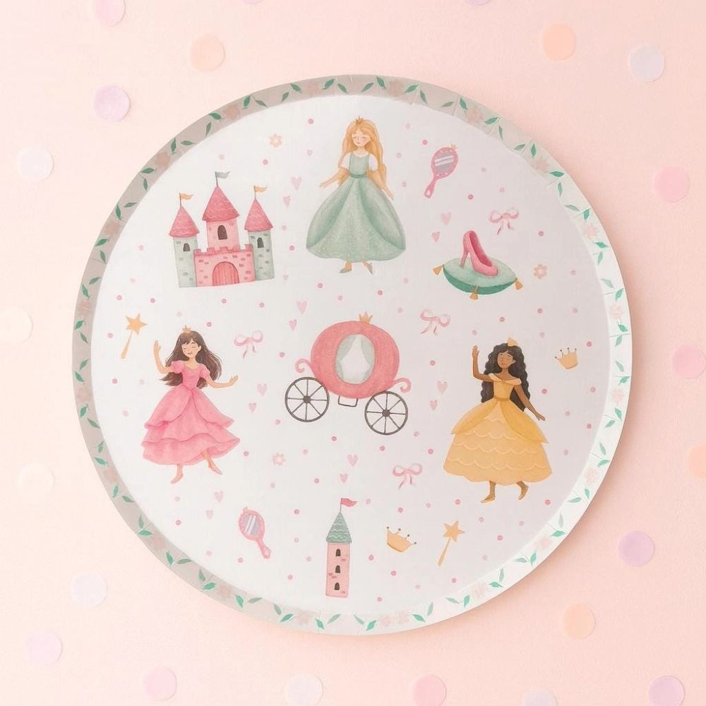 Overhead view of a princess plate on a soft pink background with confetti