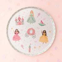 Overhead view of a princess plate on a soft pink background with confetti