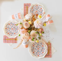 Dessert plate layered on white pumpkin-shaped plate with plaid “Grateful” napkin.