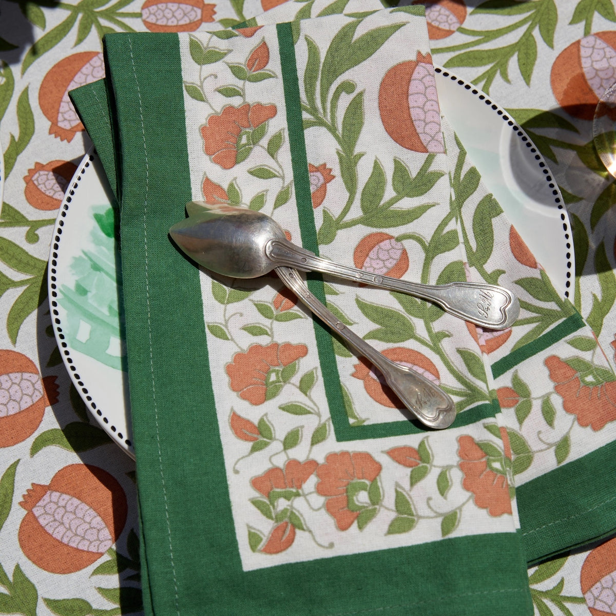 floral cloth napkin in green and orange pomegranate design - perfect for a spring table or an Easter tablescape. These are lovely spring Napkins.