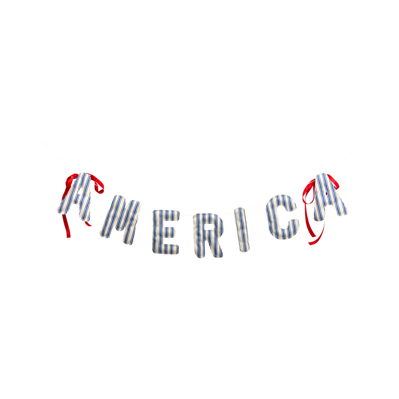Product shot of AMERICA puffy fabric letter banner with red ribbon ties on white background