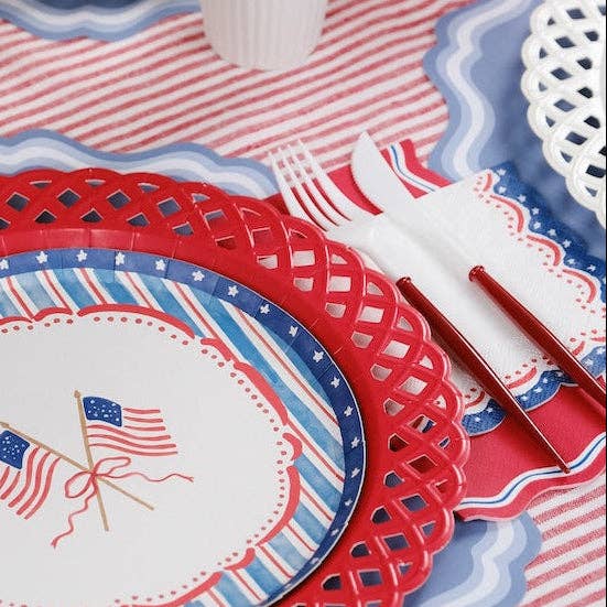 Patriotic Cocktail Napkins paired with a red lattice charger and white cutlery for a Coastal Americana Aesthetic.