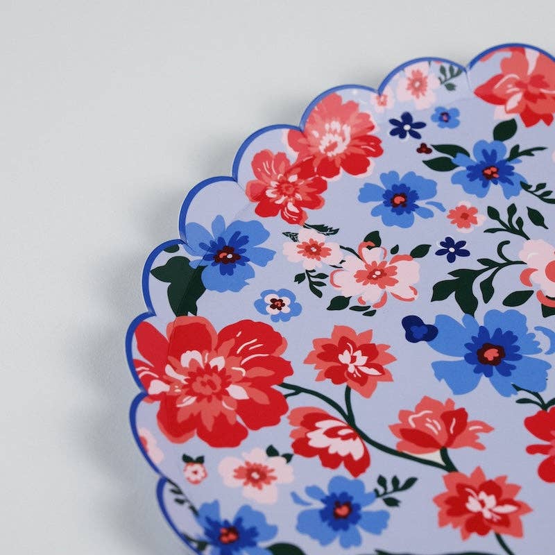 Close-up of the mid-tone blue background and saturated red florals on the Summer Floral Dinner Plates.