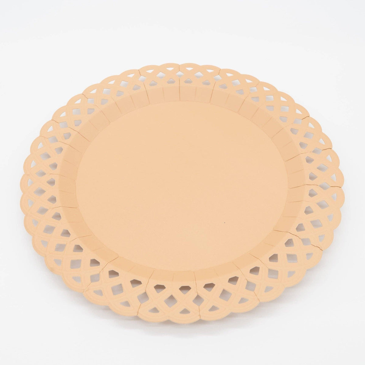 Angled studio view of the light brown scalloped basketweave paper plate against a clean white background.