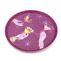 Angled studio view of the 7 inch round purple paper dessert plate resting on a clean white background.
