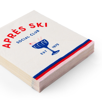 Stack of Après Ski cocktail napkins with red and blue border